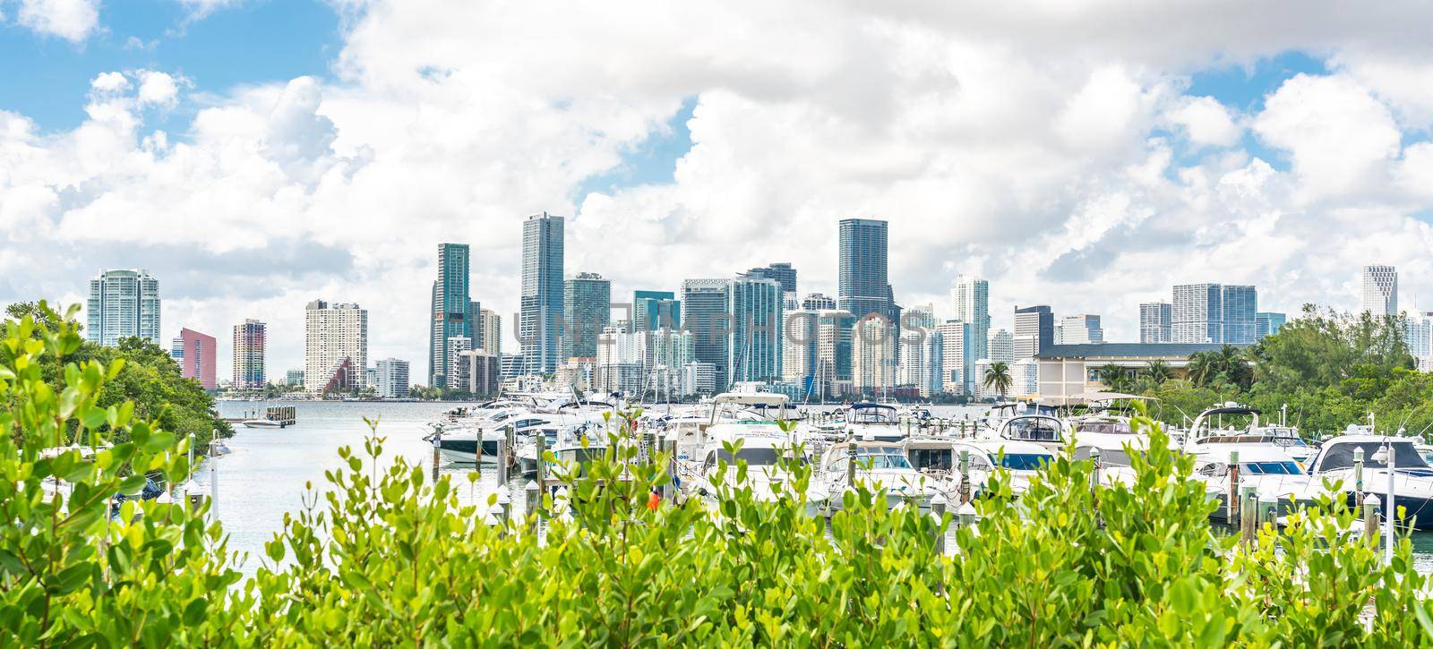 Miami, USA - September 11, 2019: Miami Downtown skyline in daytime with Biscayne Bay and yachts by Mariakray