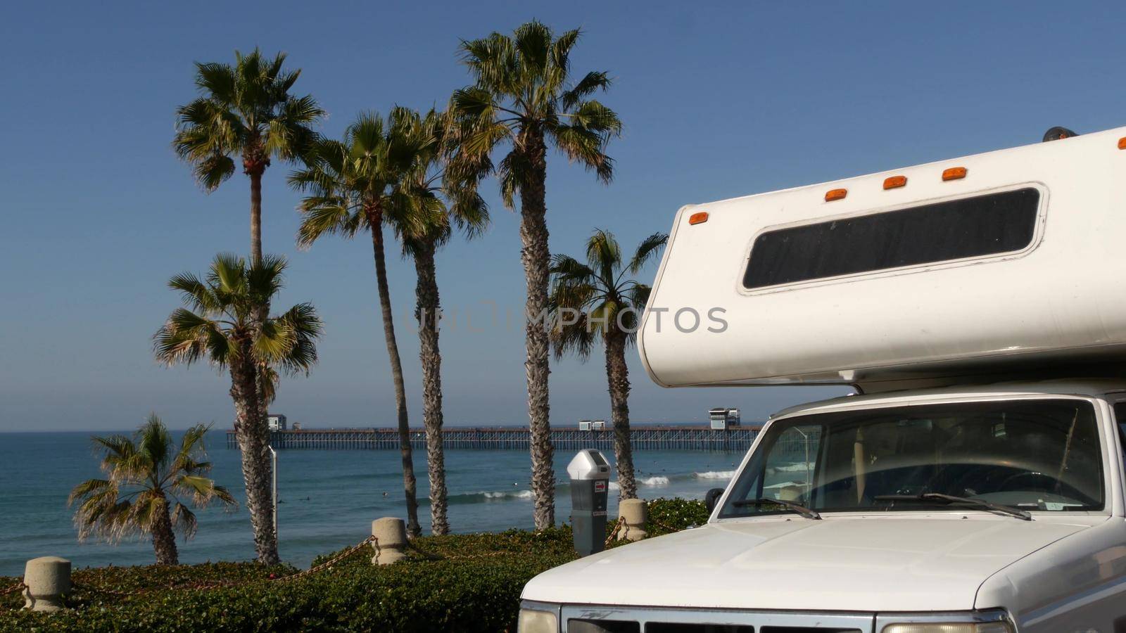Motorhome trailer or caravan for road trip. Ocean beach, California USA. Camper van, RV motor home. by DogoraSun