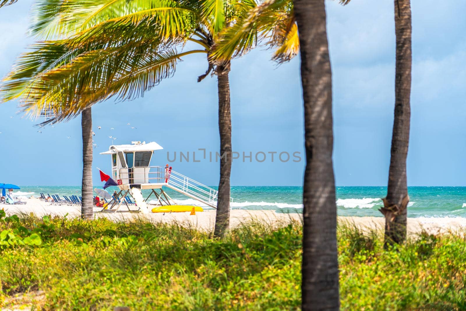 Fort Lauderdale, Florida, USA - September 20, 2019: Seafront beach promenade with palm trees