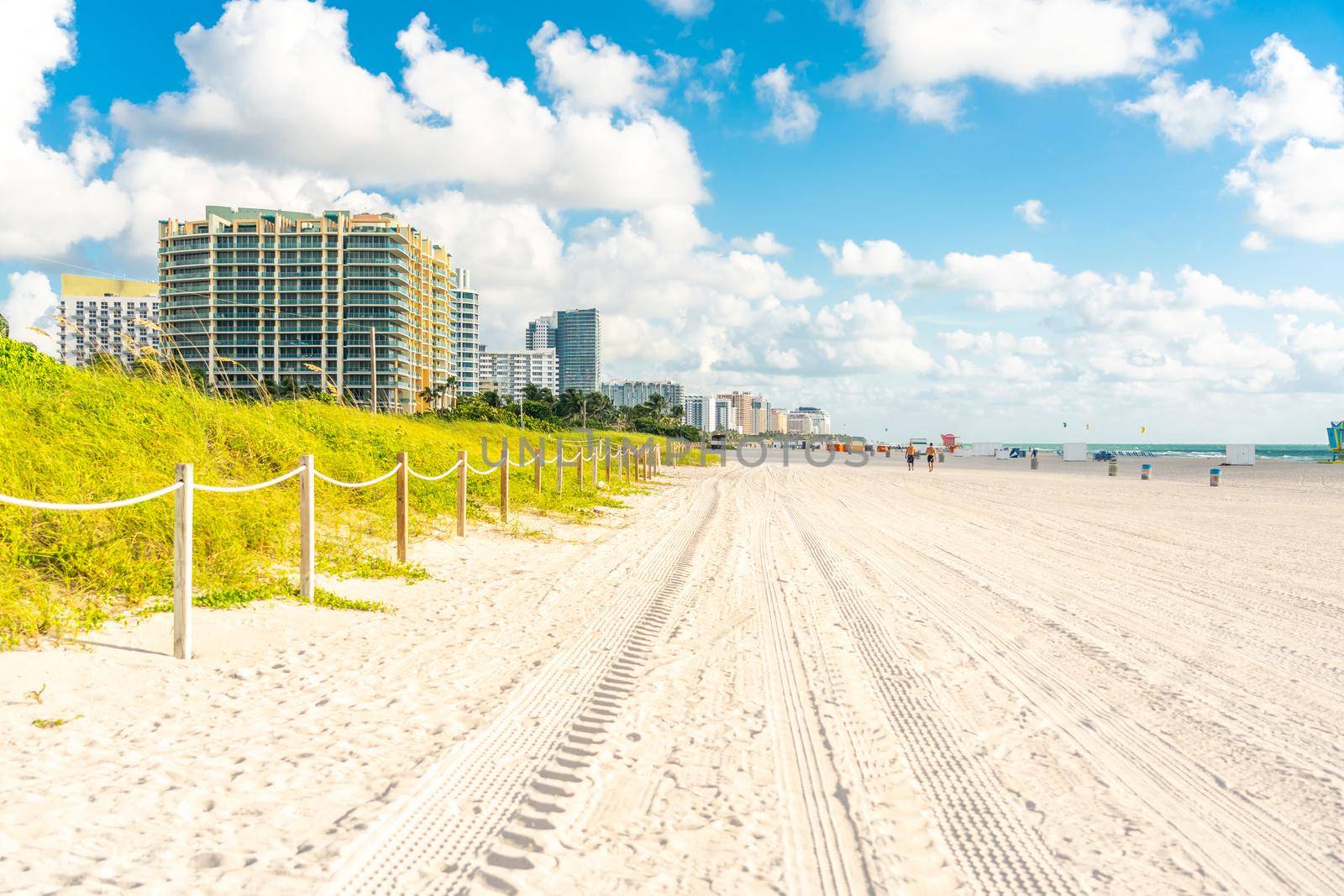 Wide South Beach in Miami Florida with grass and buildings