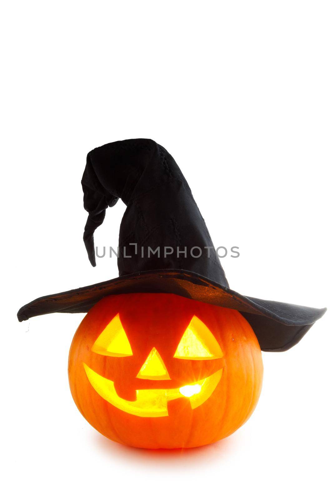 Jack O Lantern Halloween funny pumpkin with carved smiling face with witches hat isolated on white background