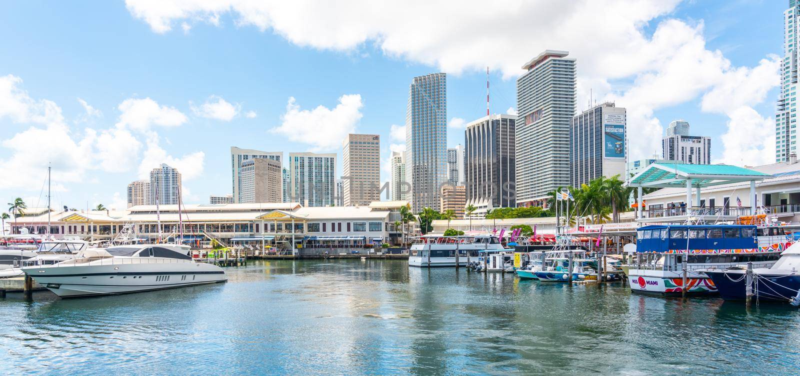 Miami, USA - September 11, 2019: View of the Marina in Miami Bayside with modern buildings and skyline in the background.