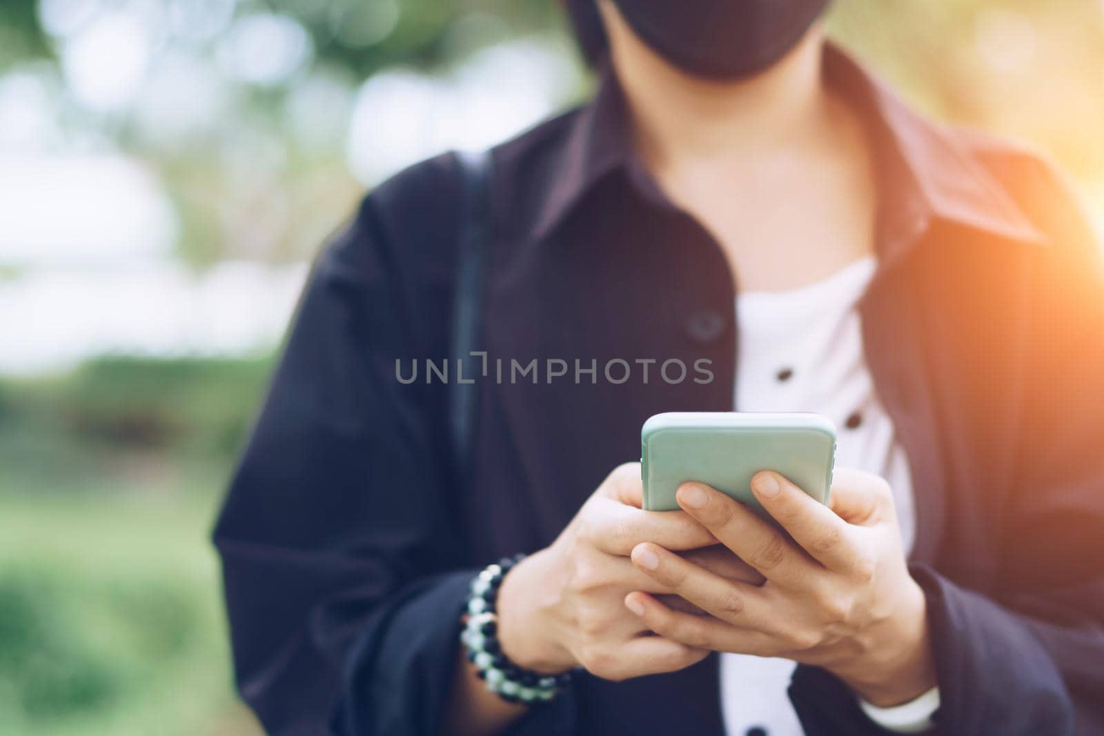 Woman hand using smartphone to do work business, social network, communication. by Suwant