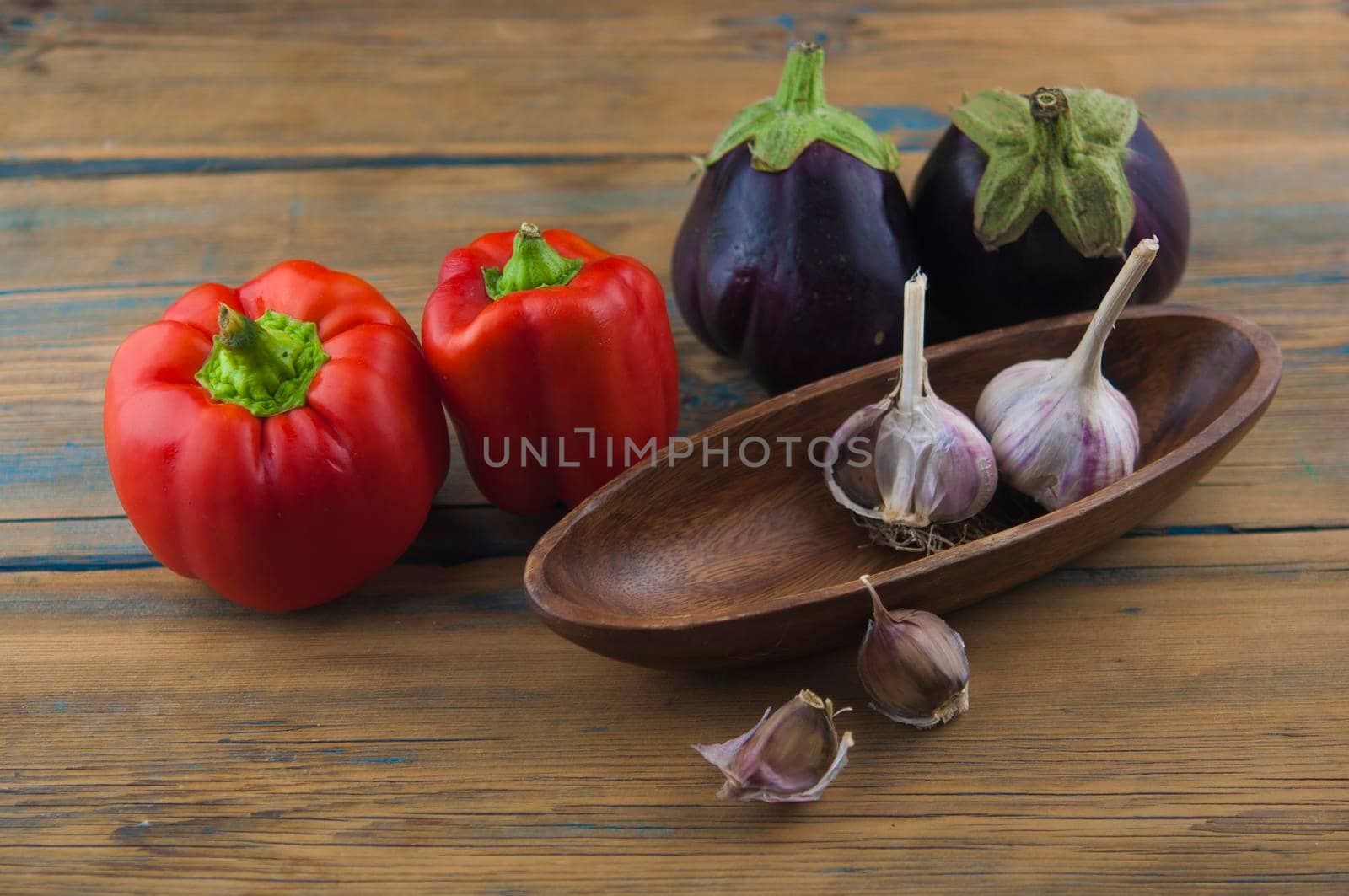 Organic vegetables still life scene on wood table by inxti