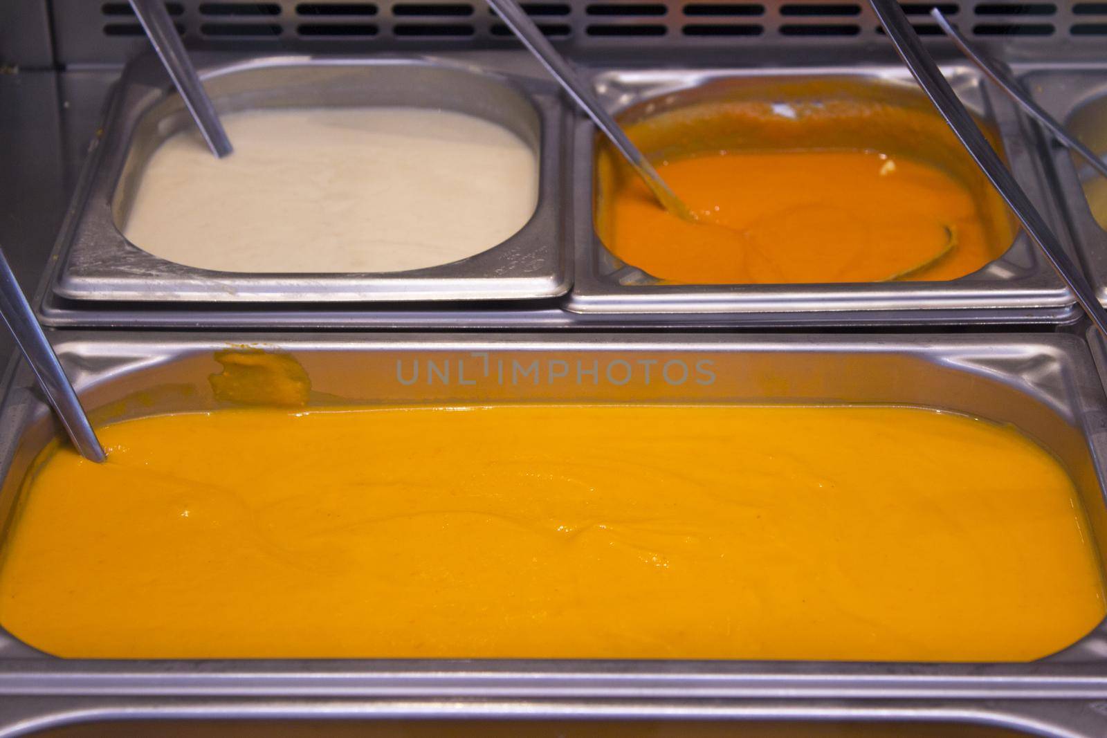 Different sauces such as tomato, mustard and mayonnaise. No people