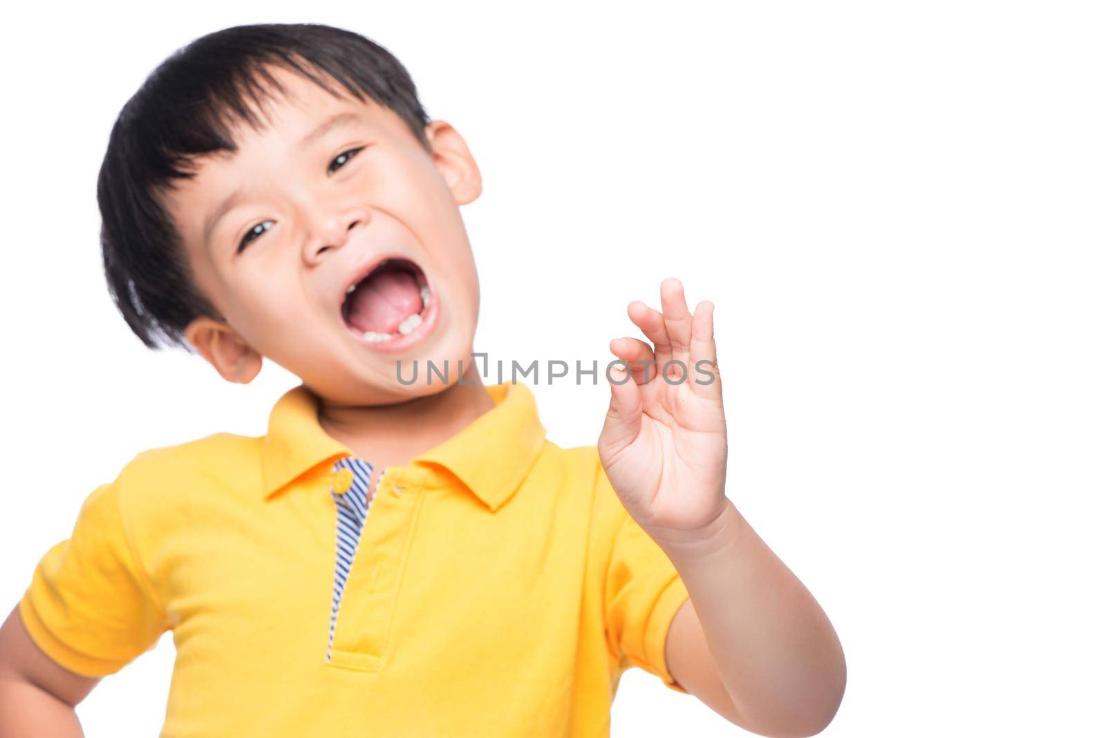 Little asian boy showing his lost milk-tooth in his hand - closeup