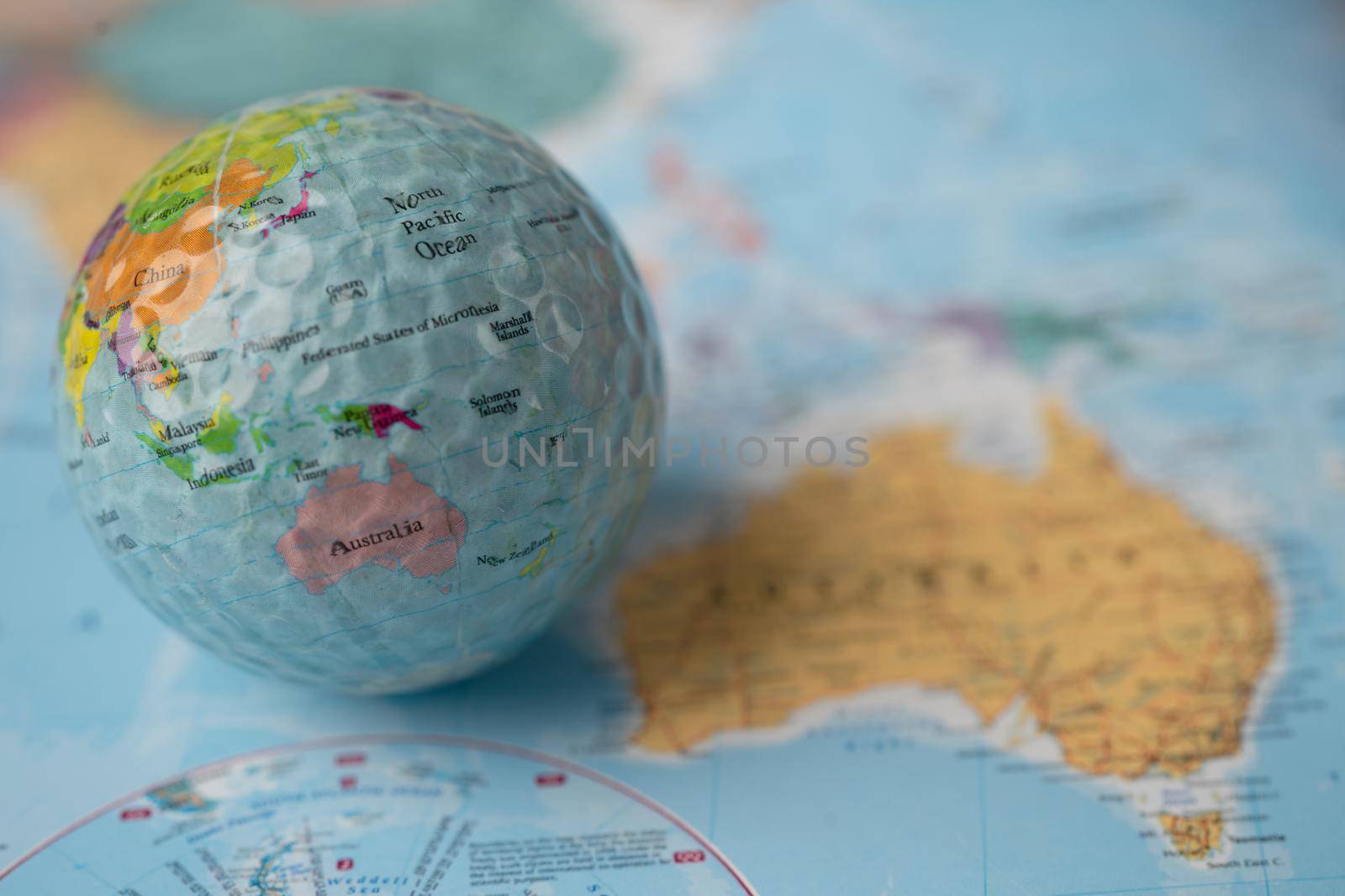 Bangkok, Thailand, May 1, 2021 Australia map at golf ball with flag on world globe map. by pamai