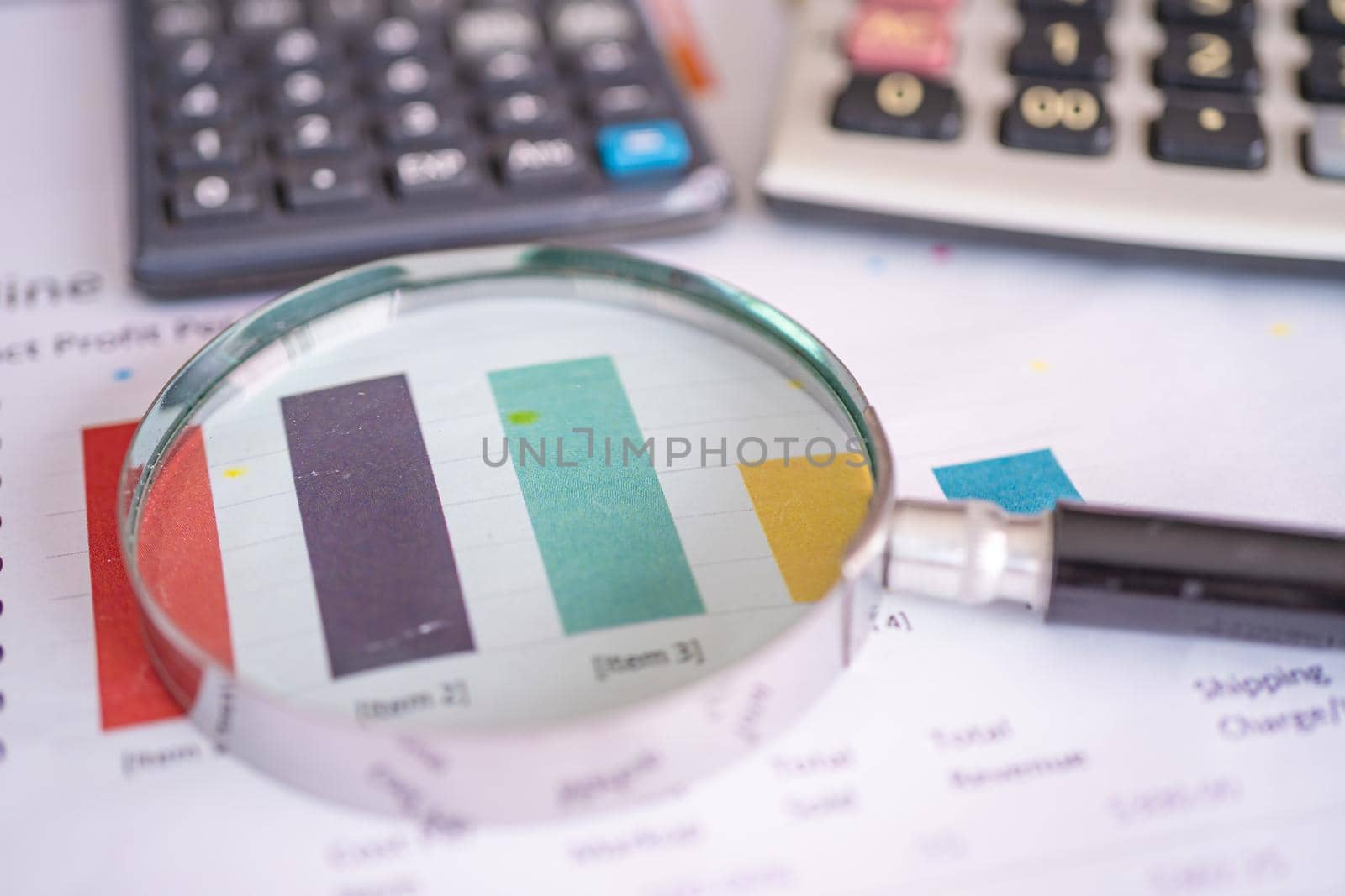 Magnifying glass on charts graphs paper. Financial development, Banking Account, Statistics, Investment Analytic research data economy, Stock exchange trading, Business office company meeting concept. by pamai