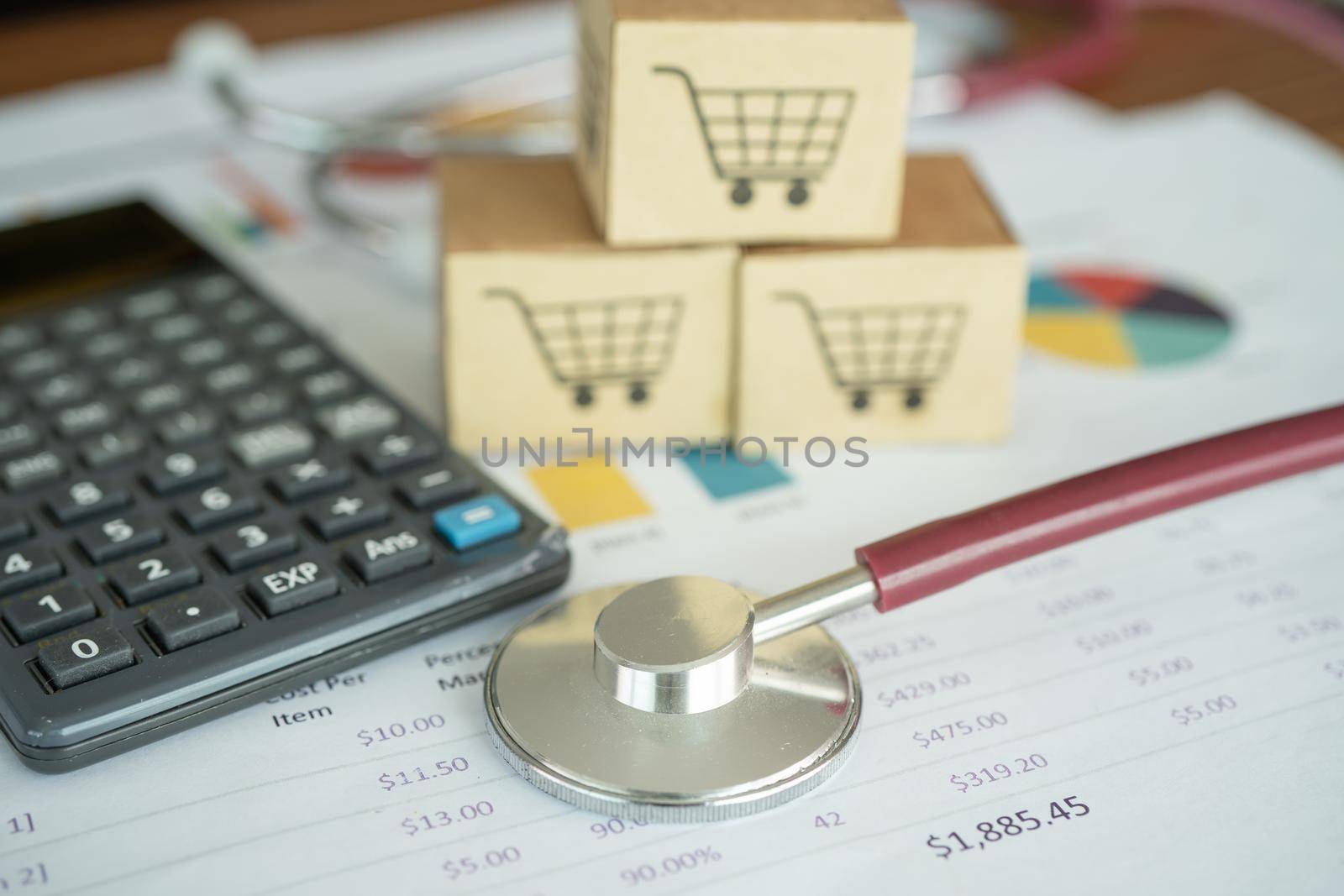 Shopping cart logo on box with magnifying glass on graph background. Banking Account, Investment Analytic research data economy, trading, Business import export transportation online company concept.