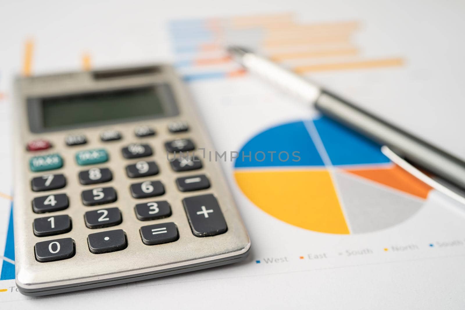 Calculator on chart and graph paper. Finance development, Banking Account, Statistics, Investment Analytic research data economy, Stock exchange trading, Business company concept.