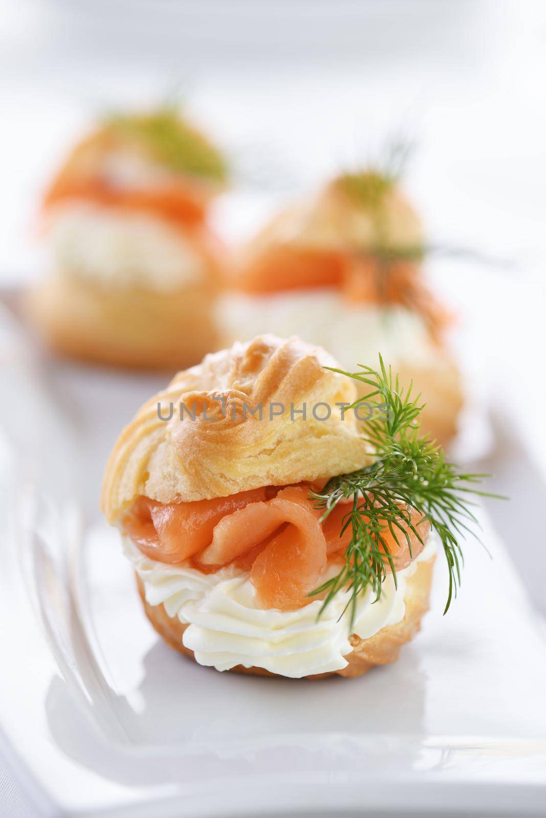 Profiteroles stuffed with cream cheese and salmon.