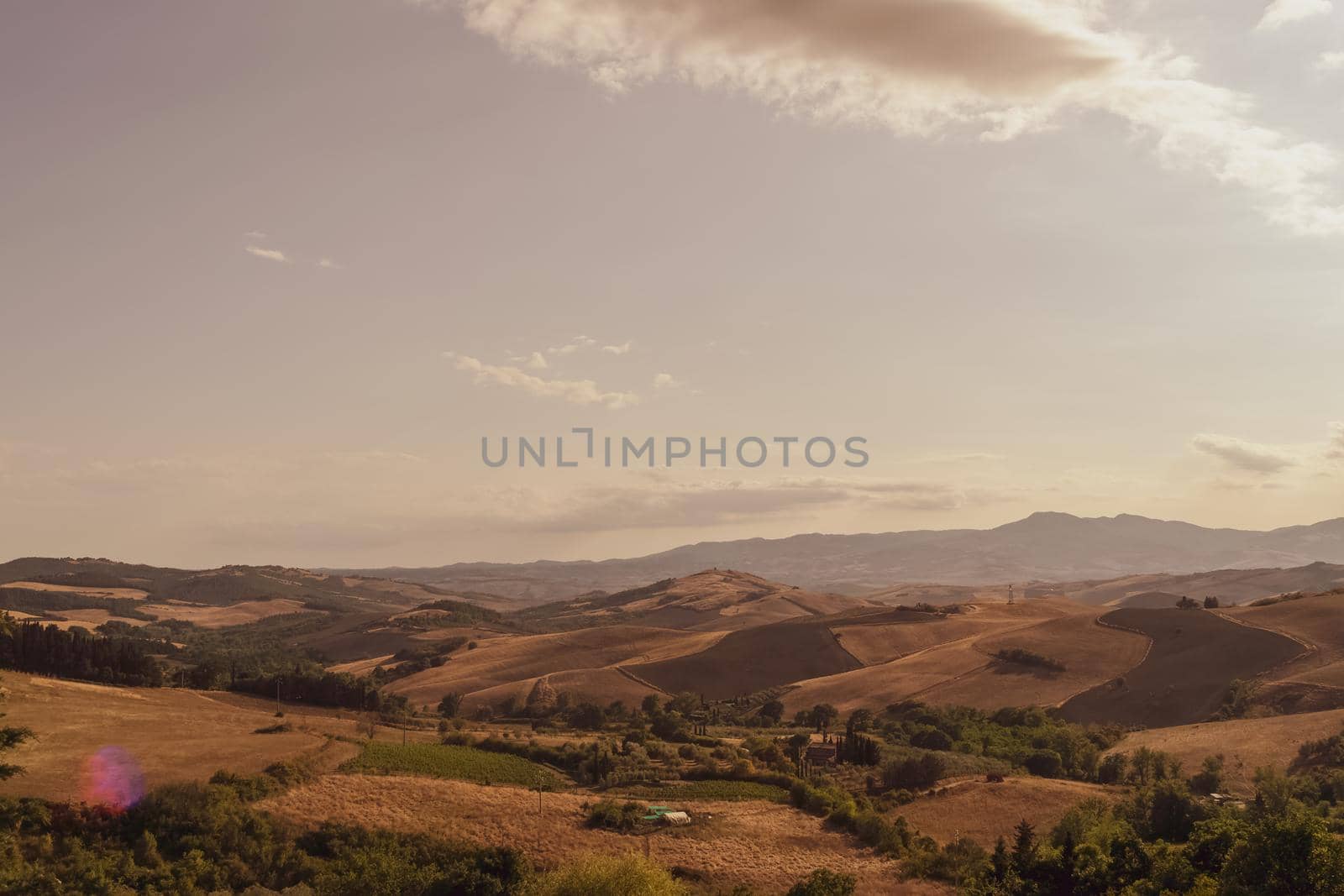 Panoramic view of the Tuscan countryside with the characteristic colors of its hills, Tuscany, Italy.