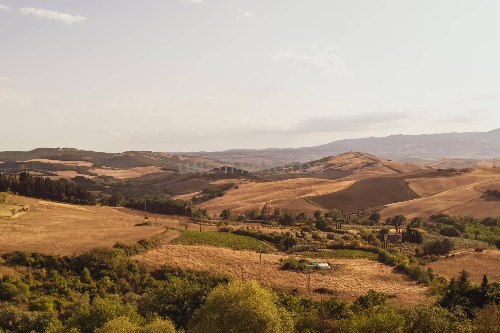 Panoramic view of the Tuscan countryside with the characteristic colors of its hills, Tuscany, Italy.