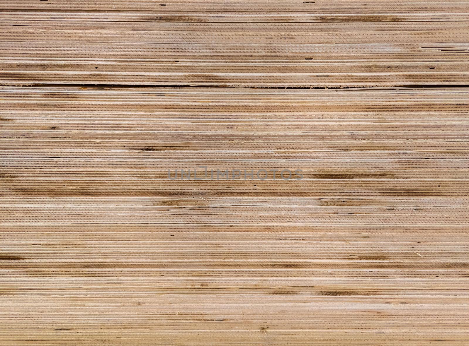 texture and flat full frame background of plywood veneer stack.