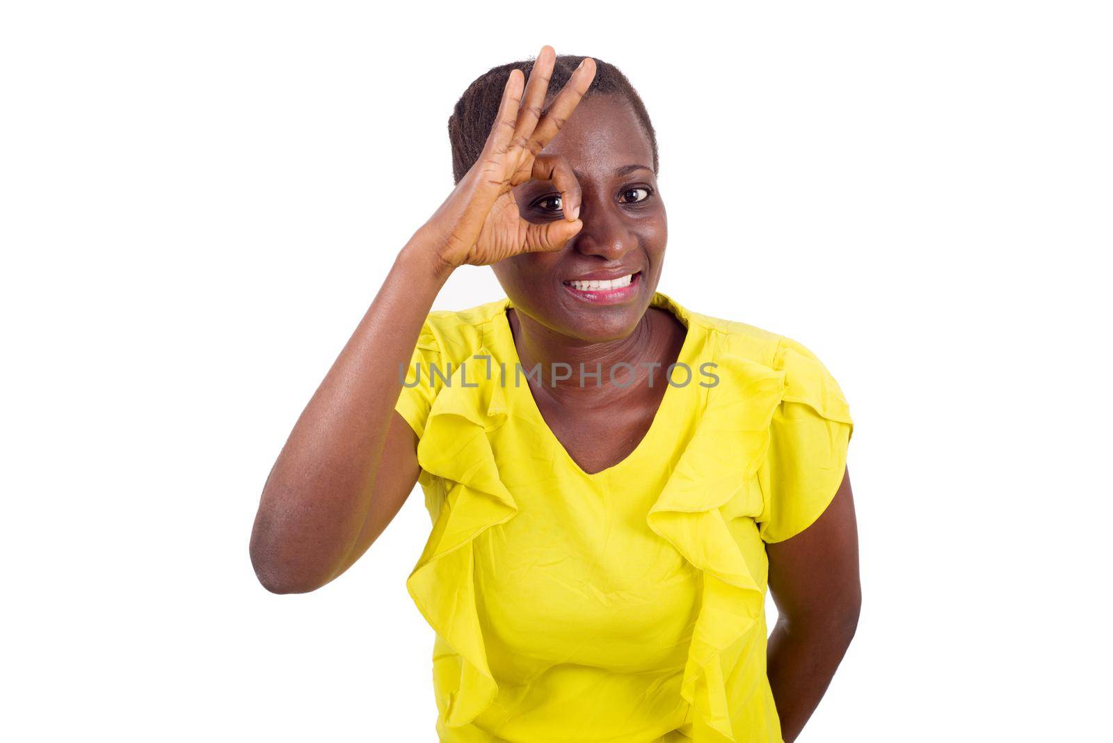 Happiness woman with a charming smile making a good gesture of being nice and showing the correct sign.