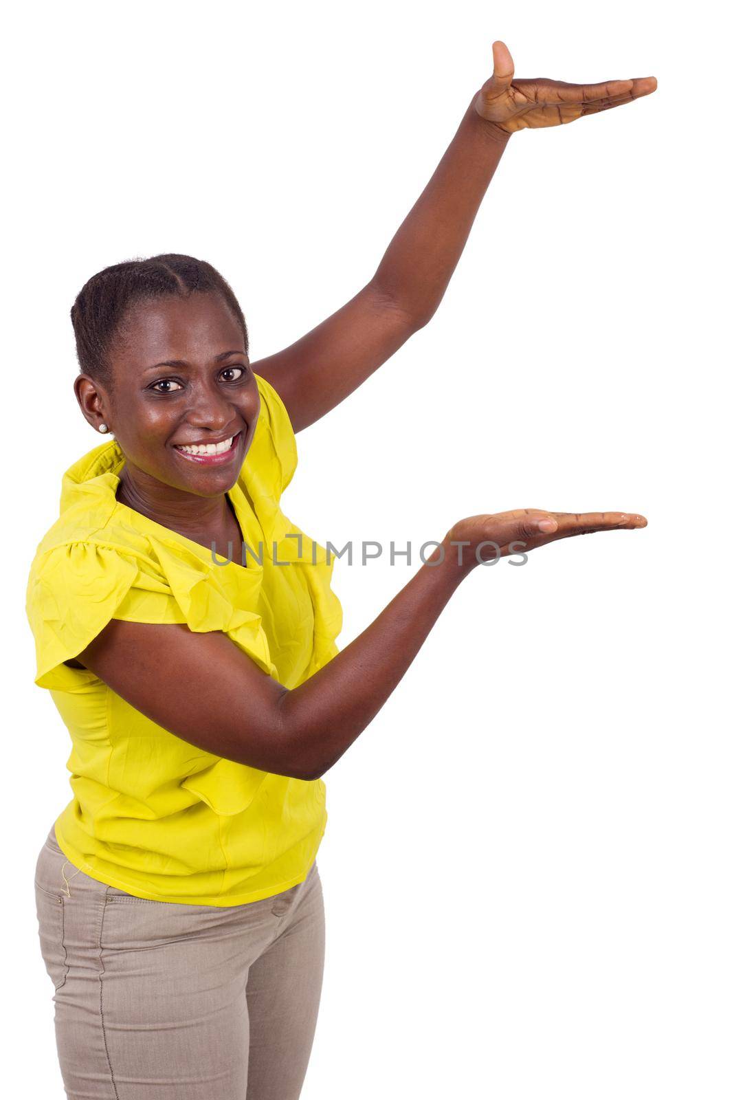 Happy woman showing empty palm space for product.Beauty fashion advertising concept. Studio shot on a white background