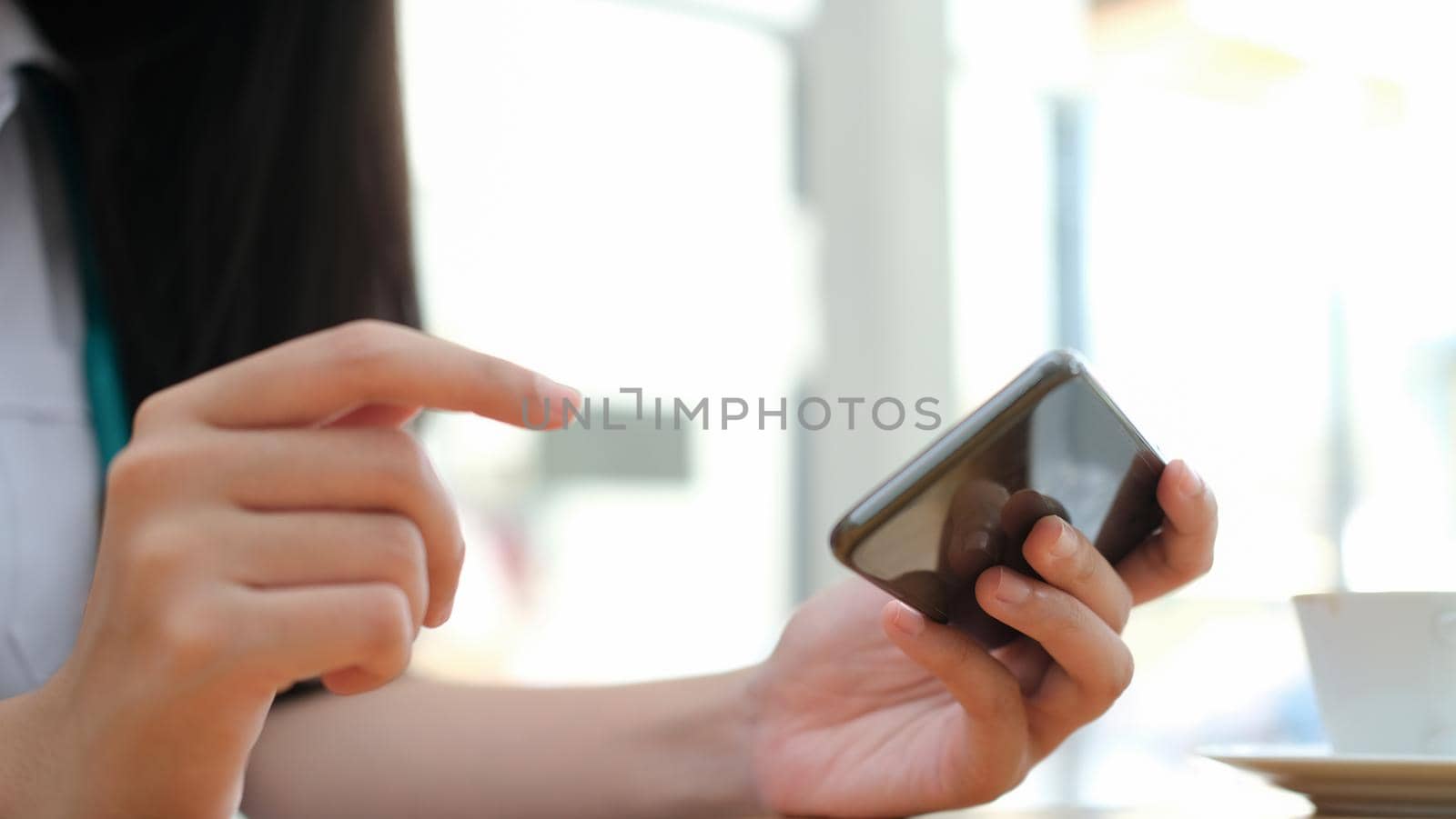 Young woman using mobile phone. Using online connect technology for business, education and communication. 
