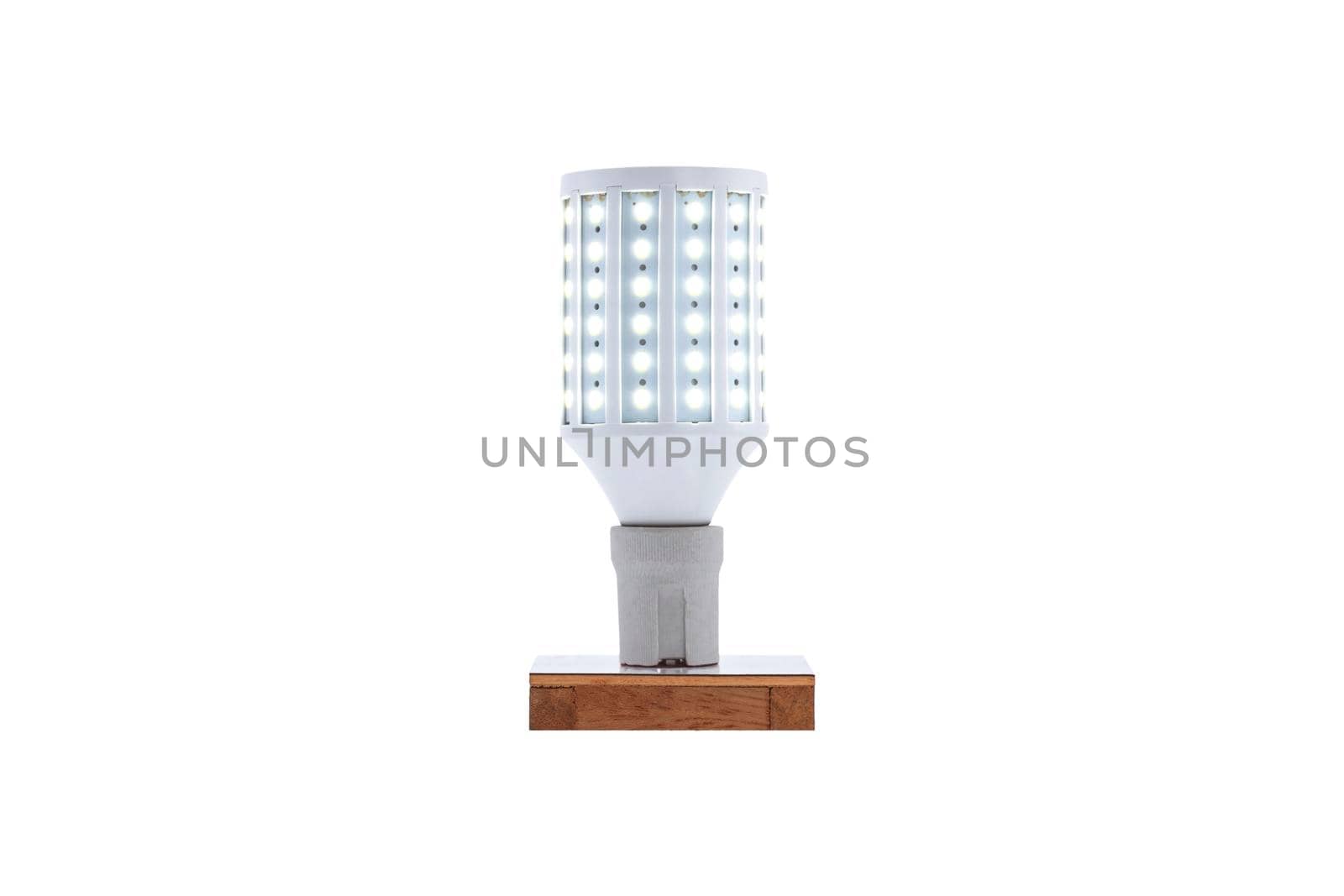 E27 230v screw-cap LED energy-saving lamp on a wooden base isolated on white background.