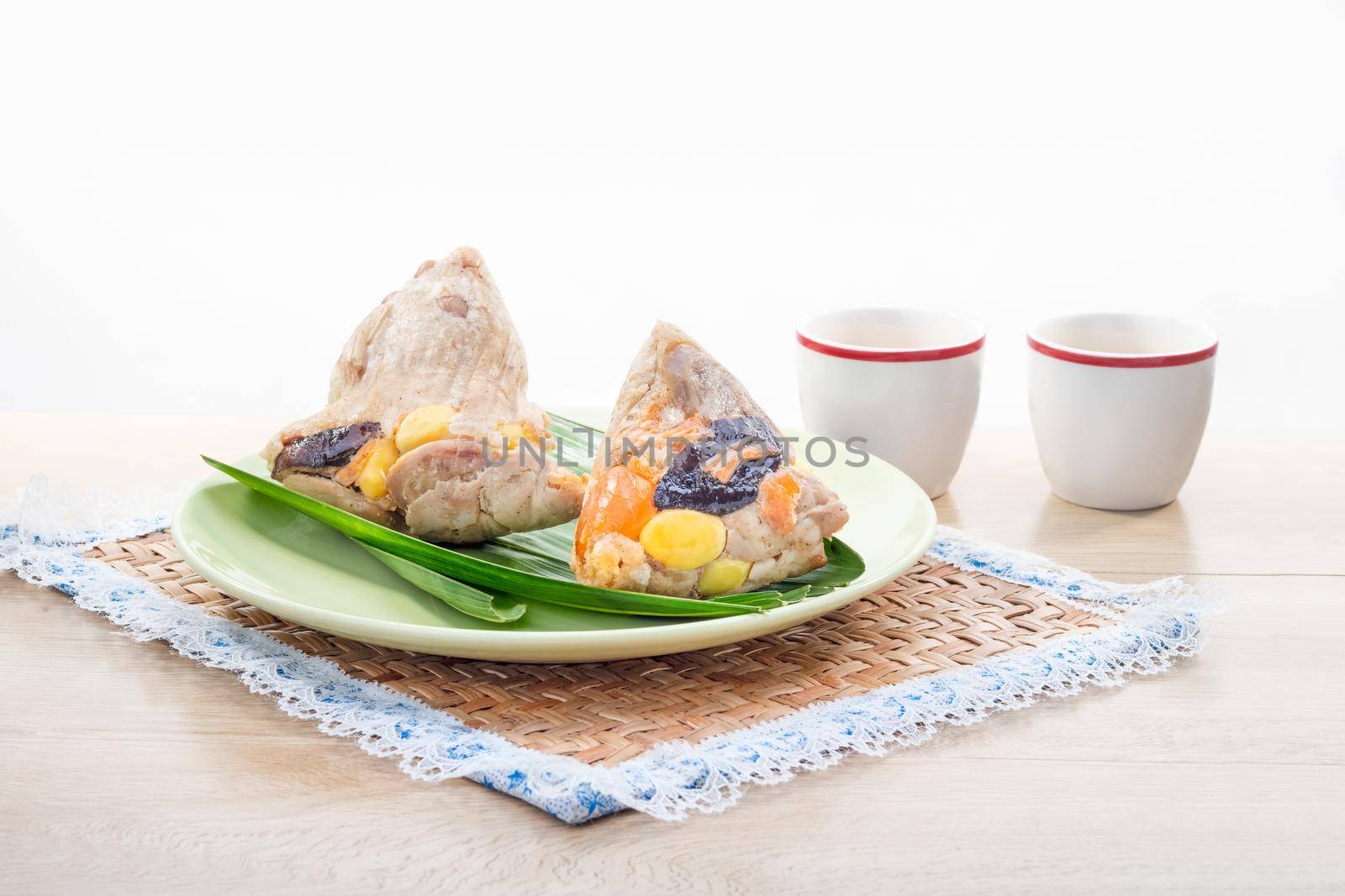 Rice dumplings or zongzi is a traditional Chinese food, made of glutinous rice stuffed with different fillings and wrapped in bamboo or reed leaves. They are cooked by steaming or boiling.