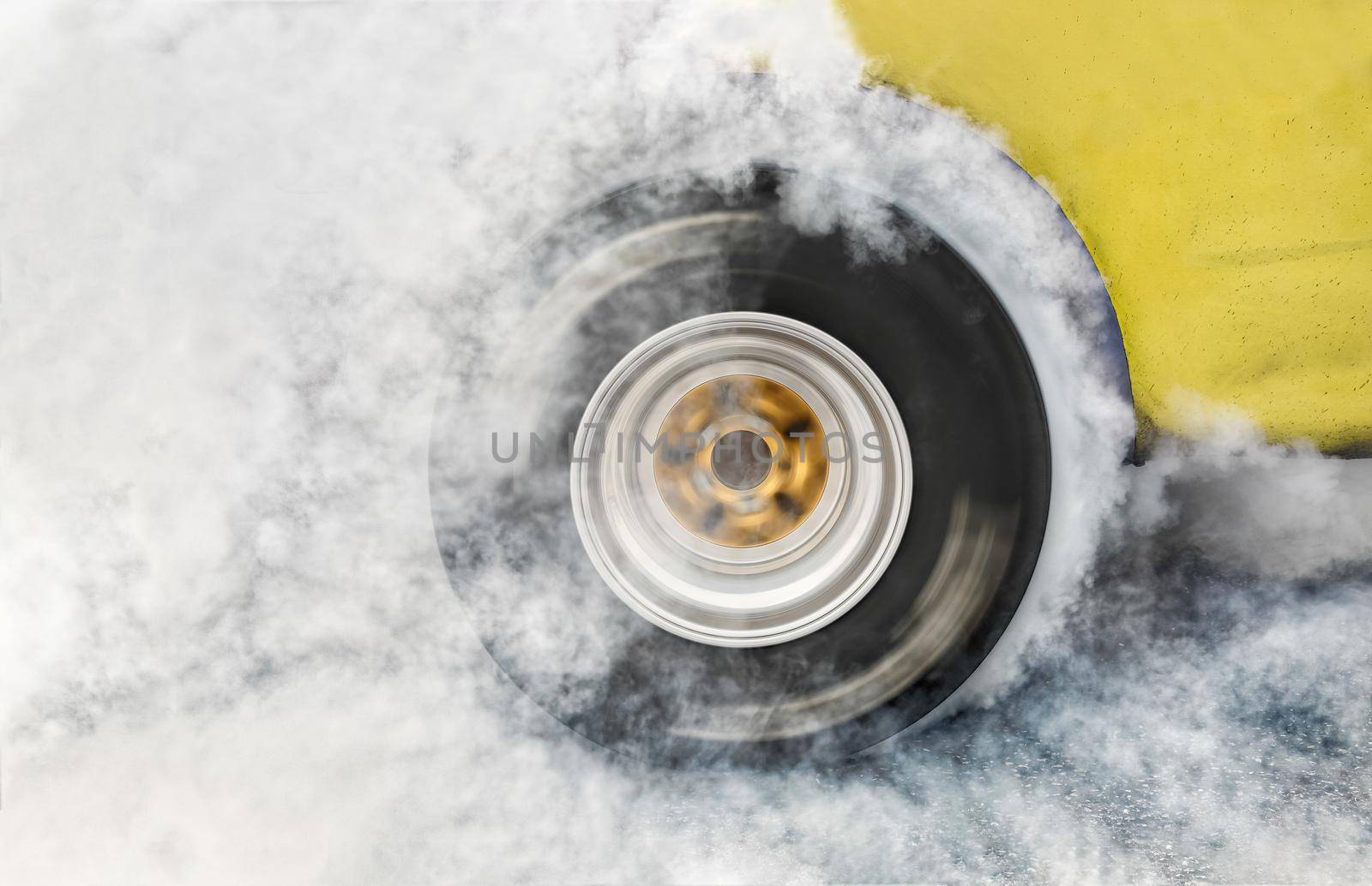 Drag racing car burns rubber off its tires in preparation for the race