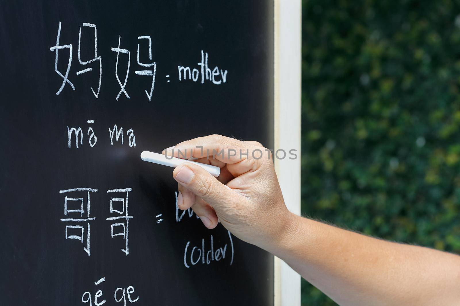 Learning chinese alphabet "pinyin" in class room.