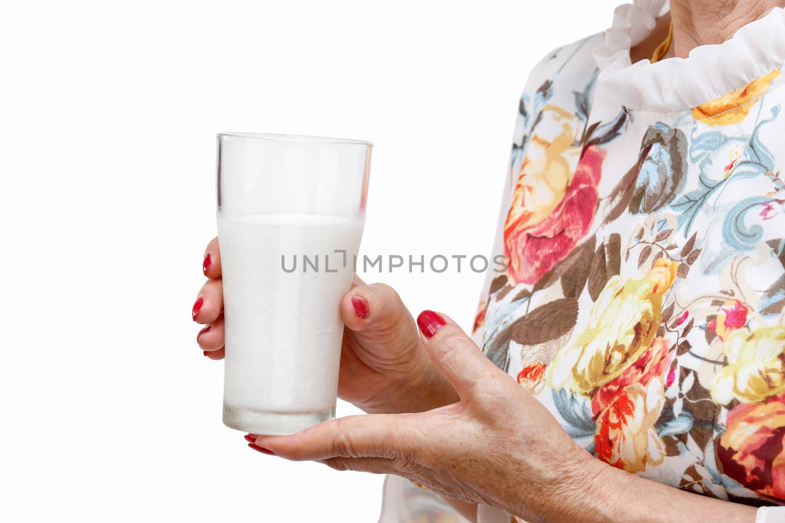 Senior woman holding a glass of milk , isolated on white background. by toa55