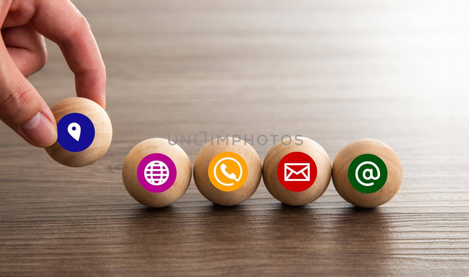 Wood sphere symbol telephone, mail, address and mobile phone.  by tehcheesiong