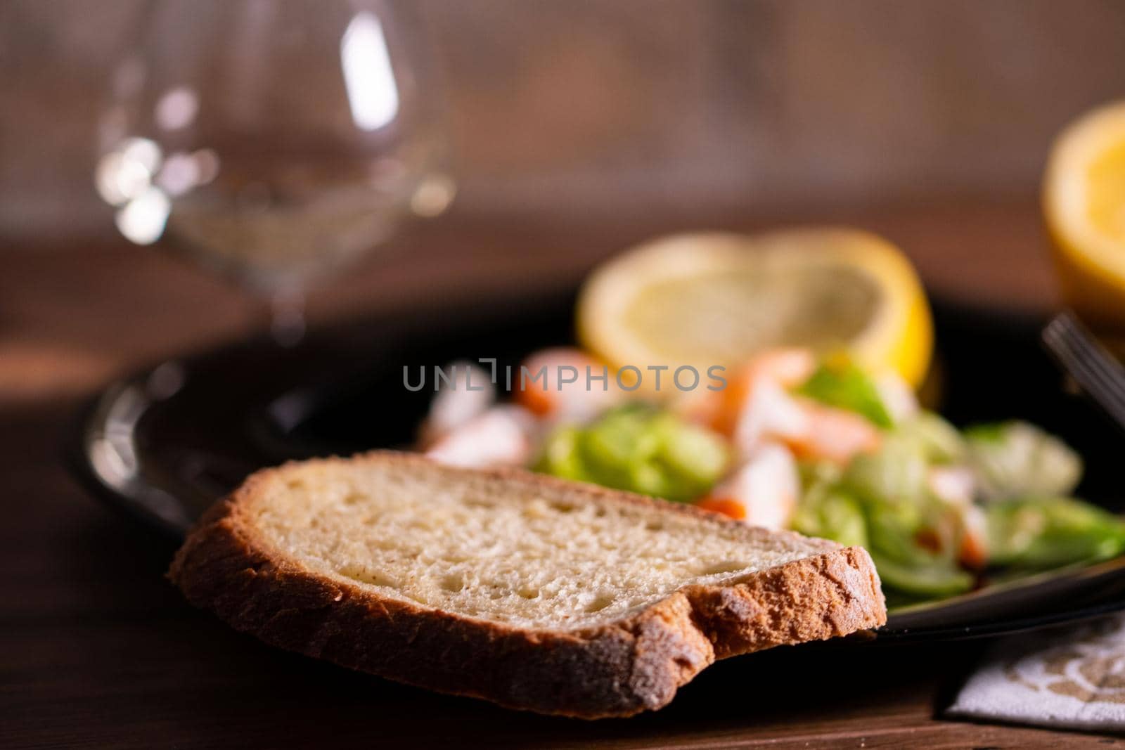 slice of bread pogiata on the edge of a plate by carfedeph