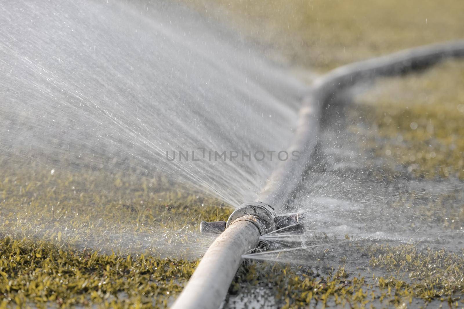 water leaking from hole in a industrial hose