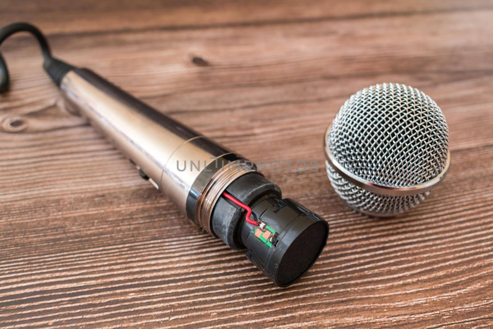 Broken disassembled sound recording microphone under repair