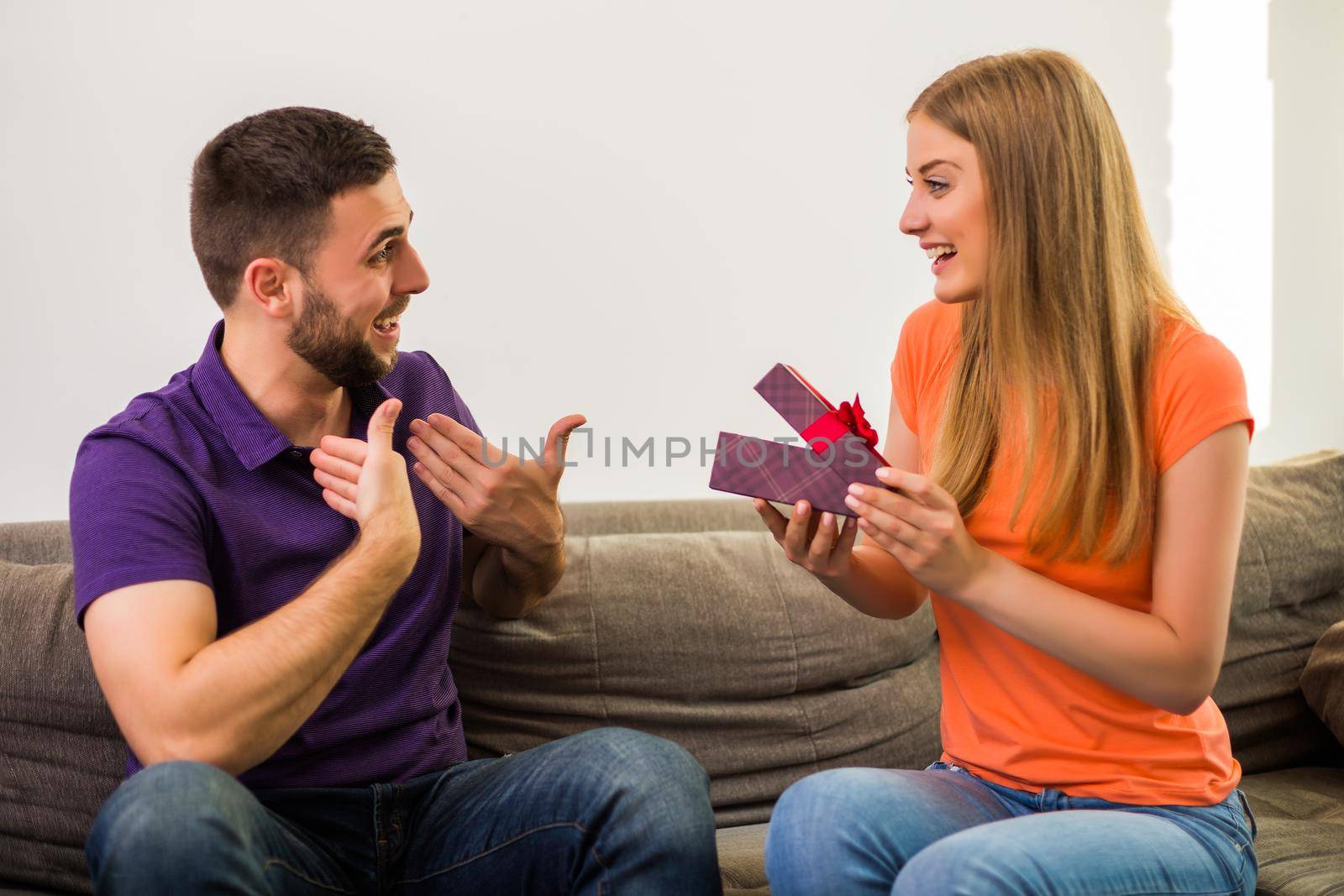 Wife giving present to her husband by Bazdar