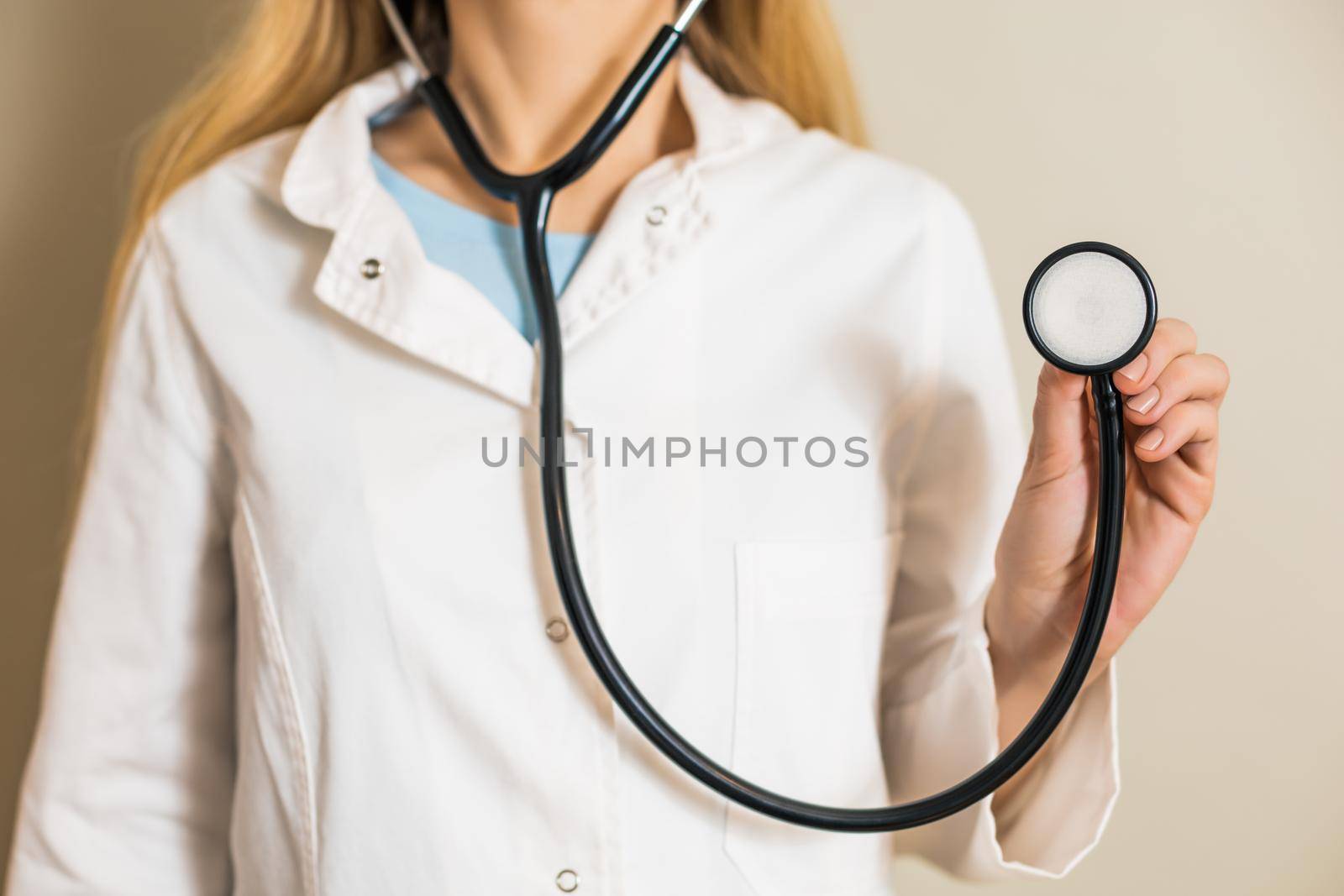 Image of female doctor holding stethoscope.