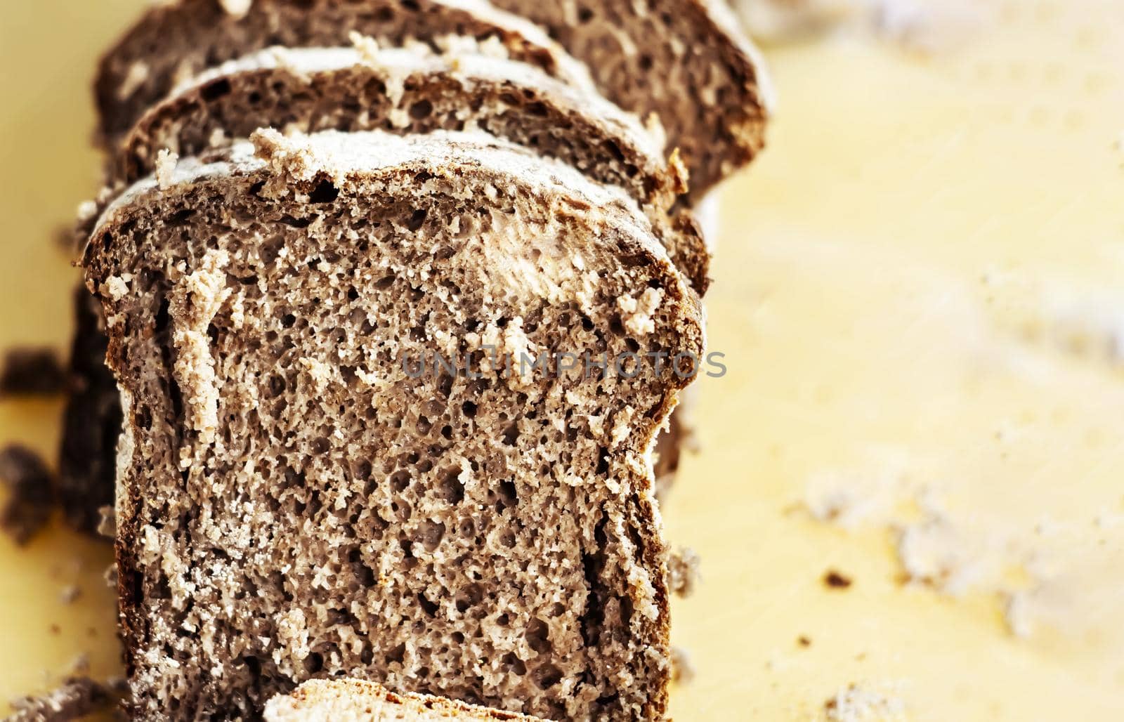 Close-up view of some slices of fresh rye bread. Healthy food and source of fiber. Bakery product