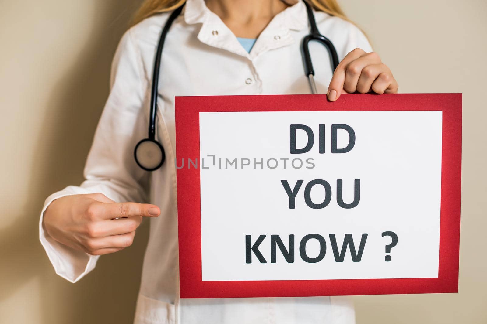 Image of female doctor holding a paper with a text  did you know.