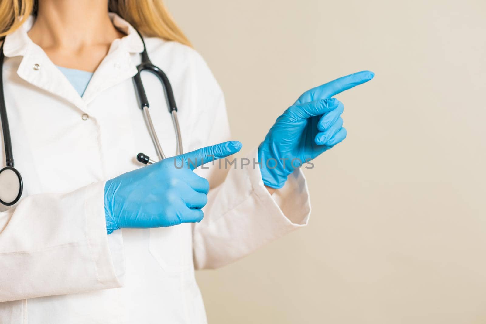 Image of female doctor pointing .