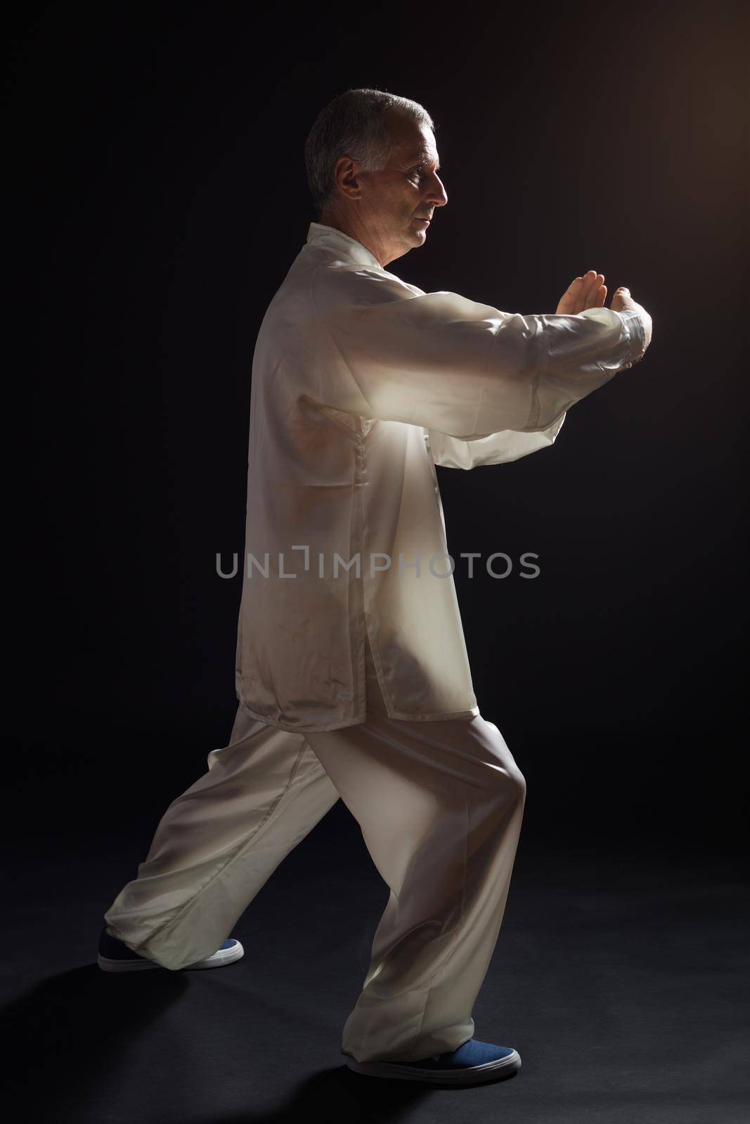 Senior man  exercise Tai Chi by Bazdar