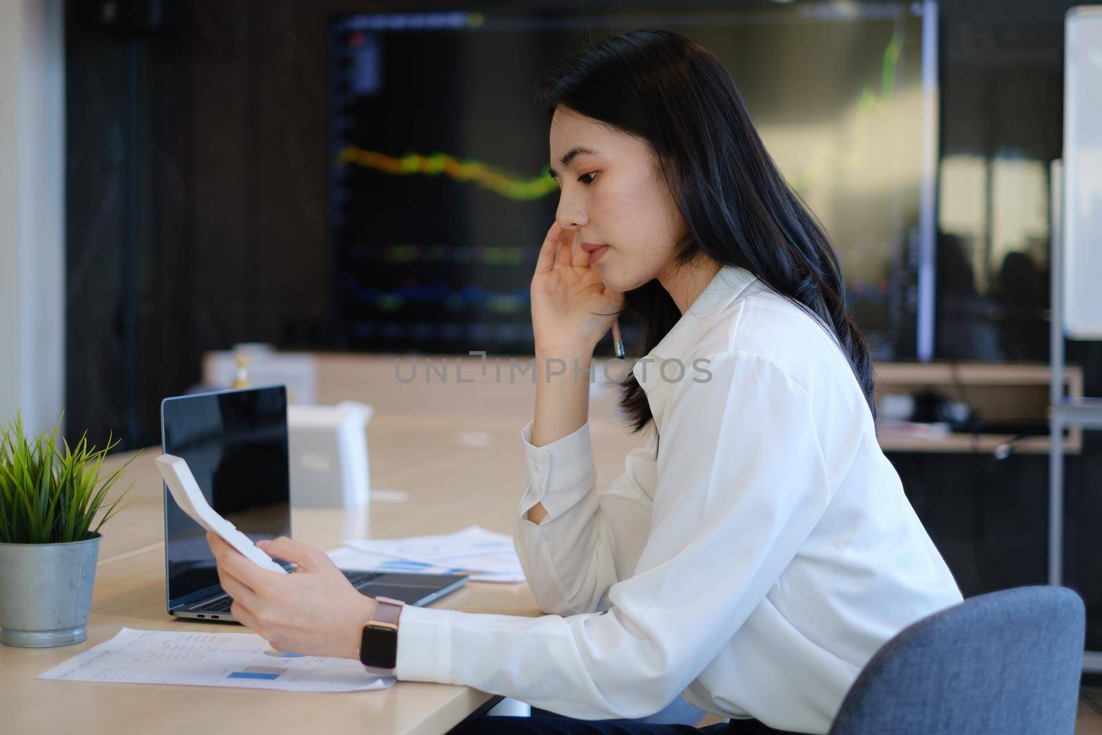 Cheerful young asian woman working with computer at home. Student female in living room. online learning, studying , online shopping, freelance, asean concept.