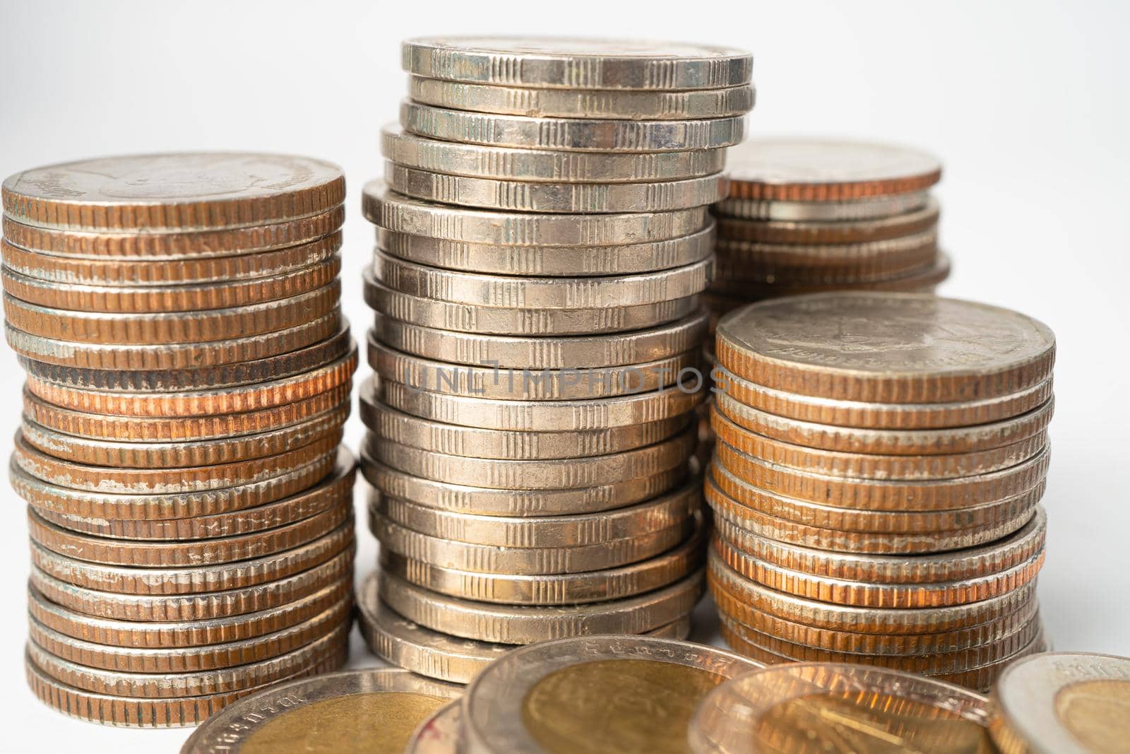 Stack of Thai baht coins on white background, Business finance investment concept.