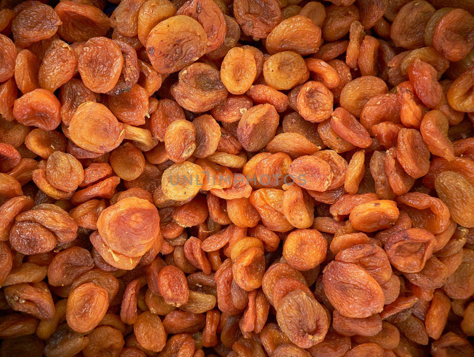 Dried apricot fruit forming a background.Group of dried fruits of apricot, close up