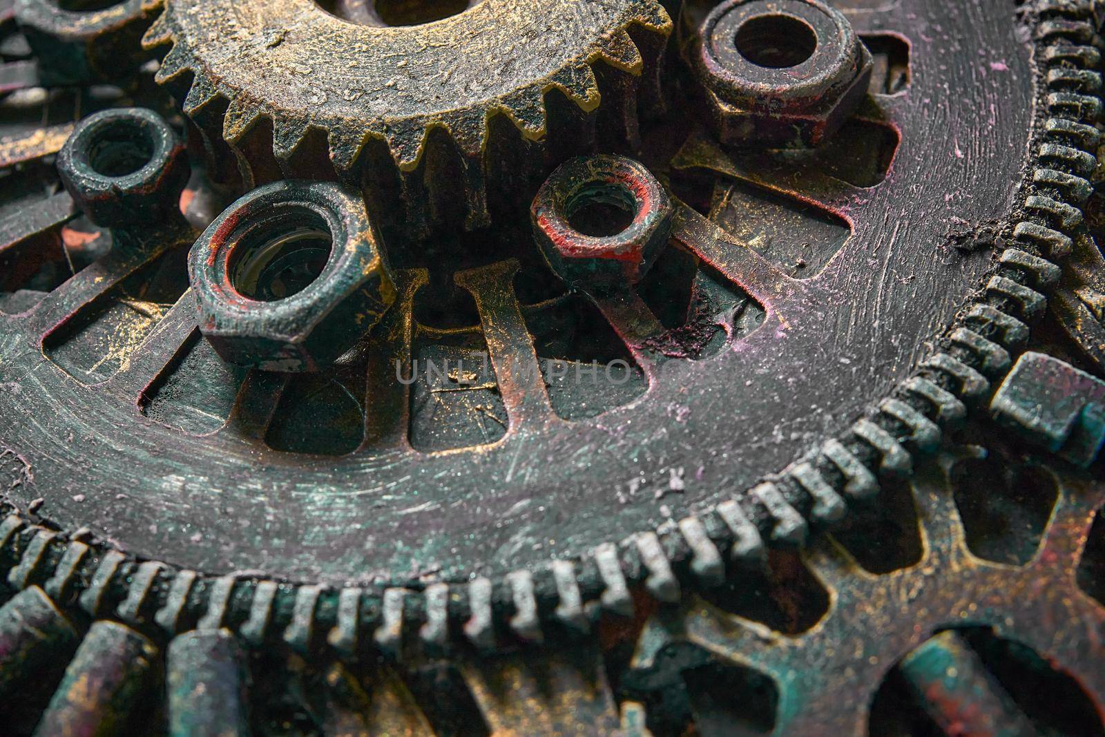 Machine gear, metal cogwheels, nuts and bolts.Selective focus