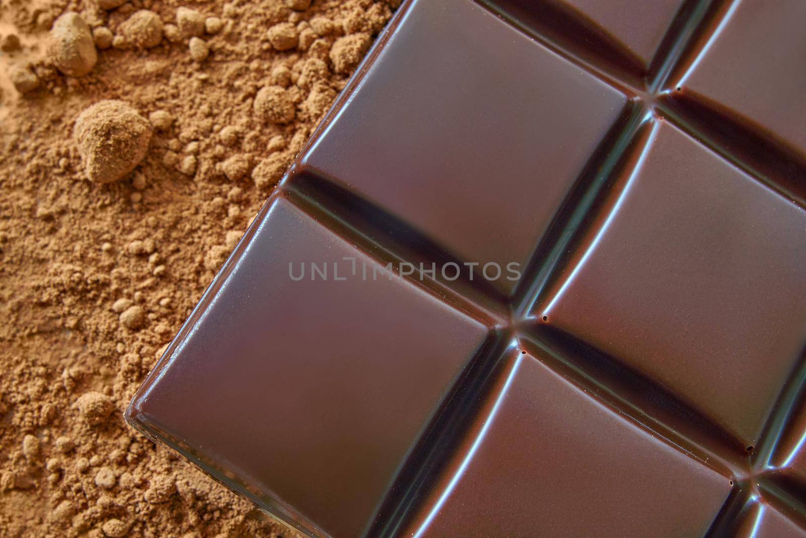 Aromatic cocoa and chocolate, lying on top