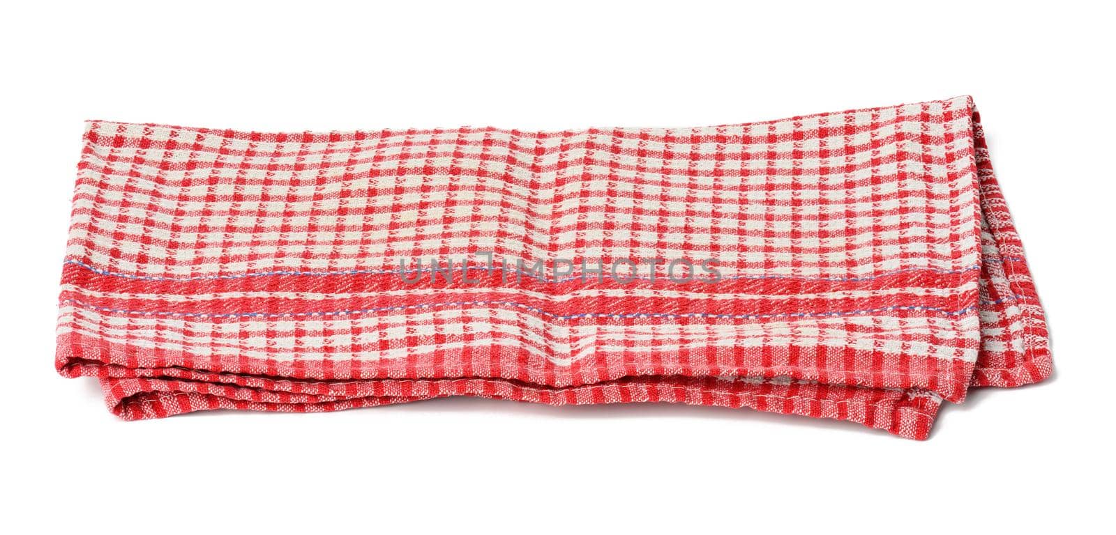 folded cotton red white checkered napkin on a white background by ndanko