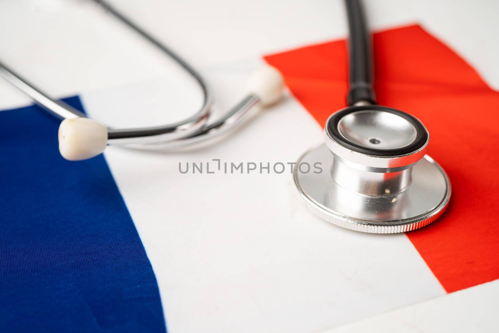 Black stethoscope on France flag background, Business and finance concept.