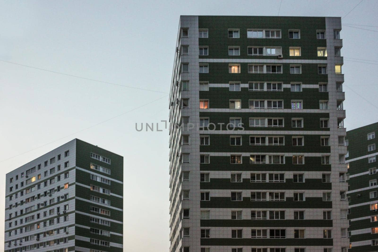 Photo of a multi-storey building and a light blue sky
