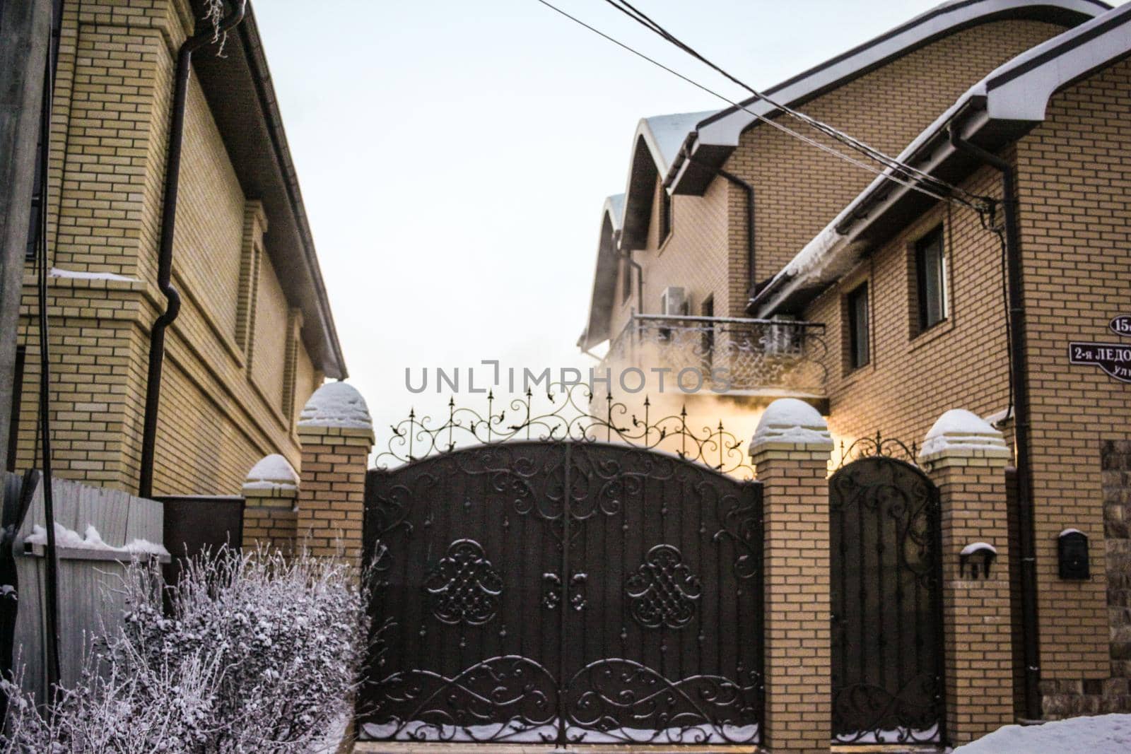 House gate and smoke in winter
