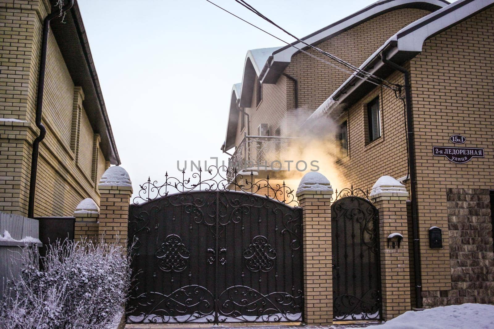 House gate and smoke in winter
