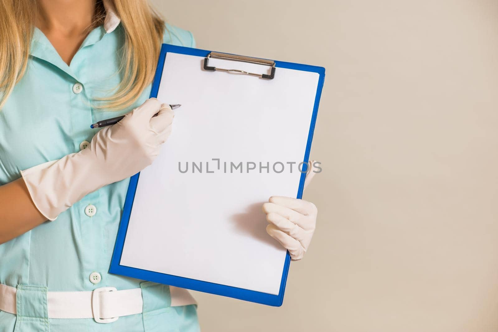 Image of medical nurse showing document.