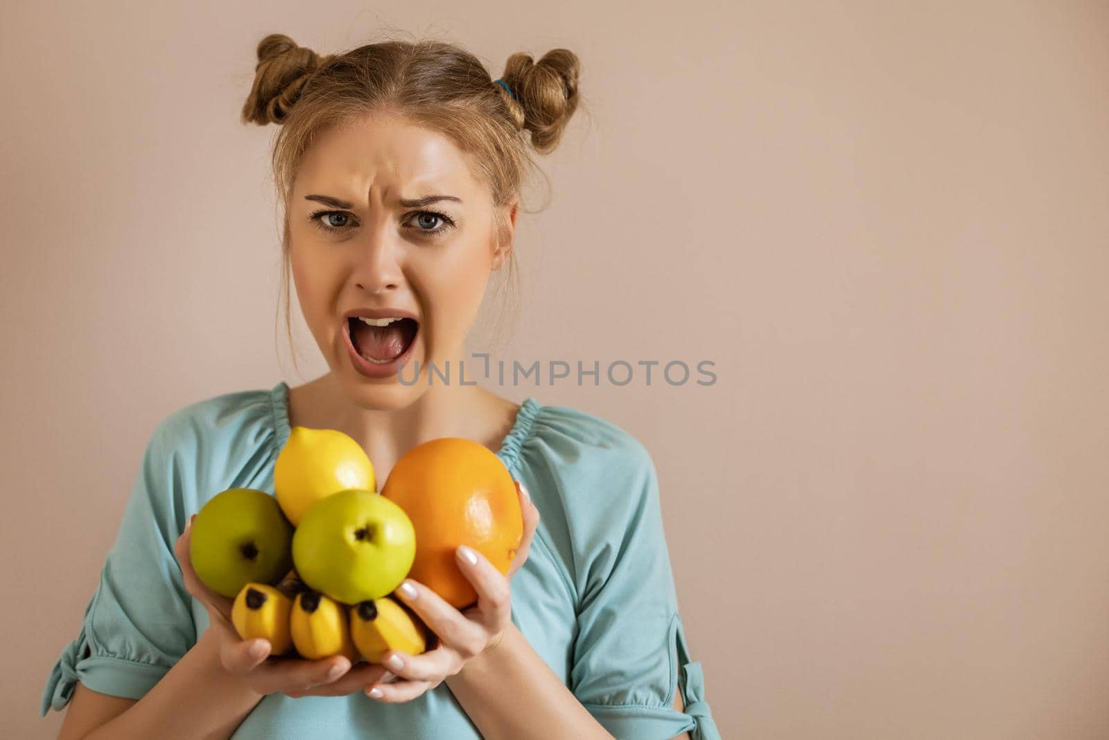 Angry woman shouting because she is tired of dieting.Toned image.
