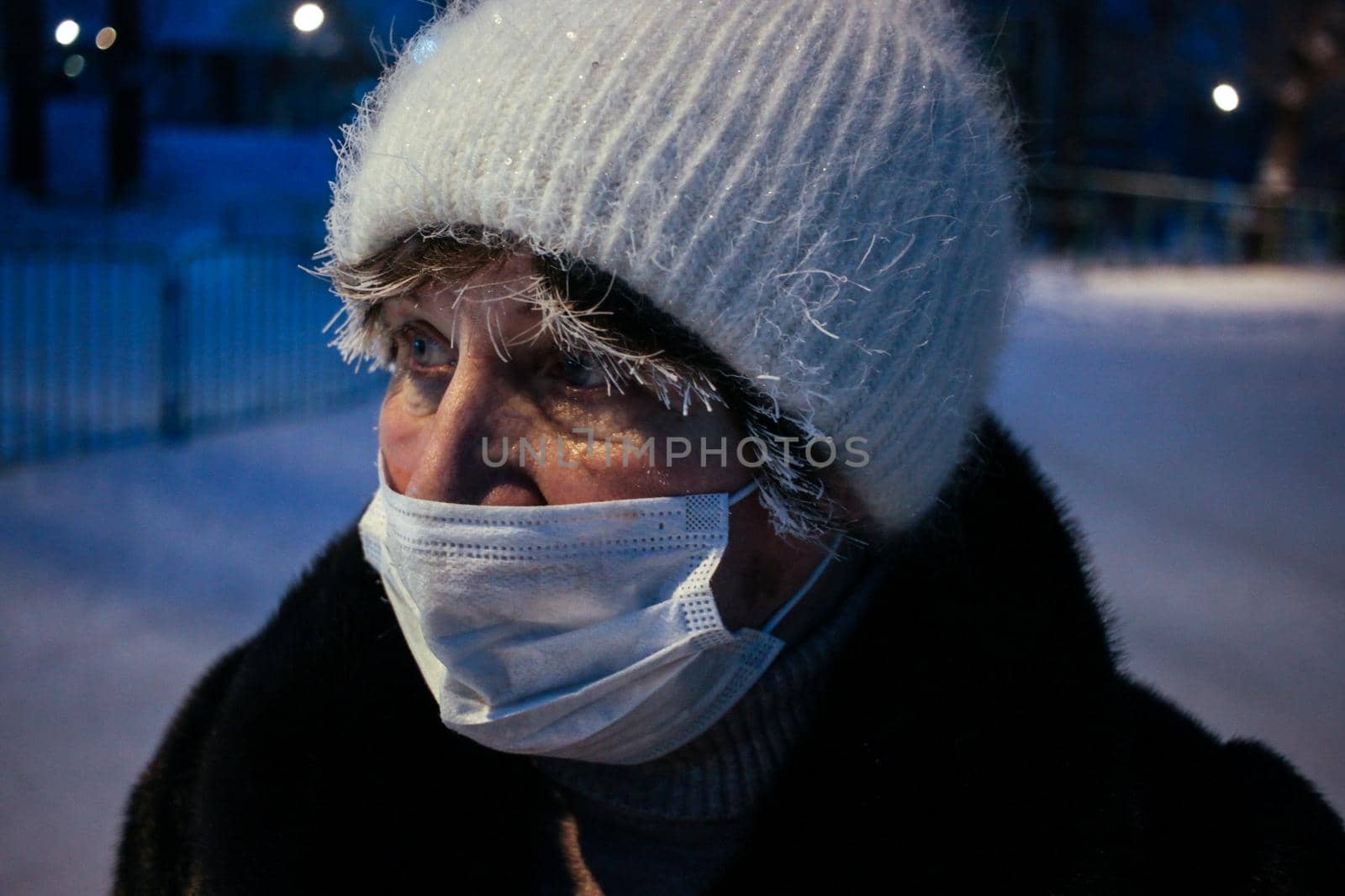 Adult woman winter portrait with face mask