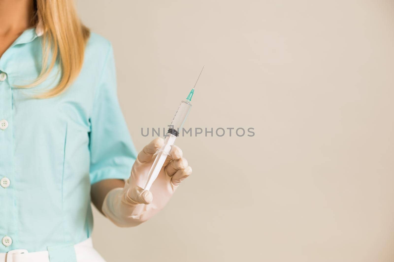 Medical nurse holding injection by Bazdar